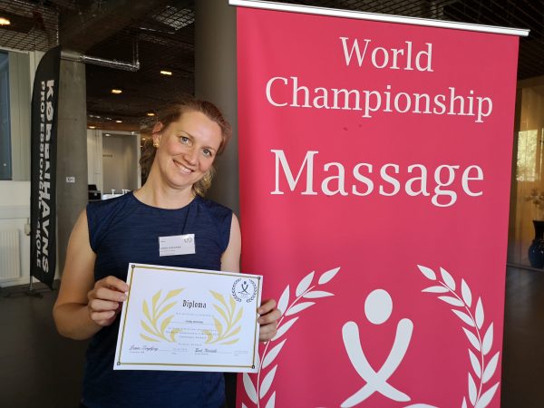 Les Thermes de Kain practitioner with her World Championship Massage certificate
